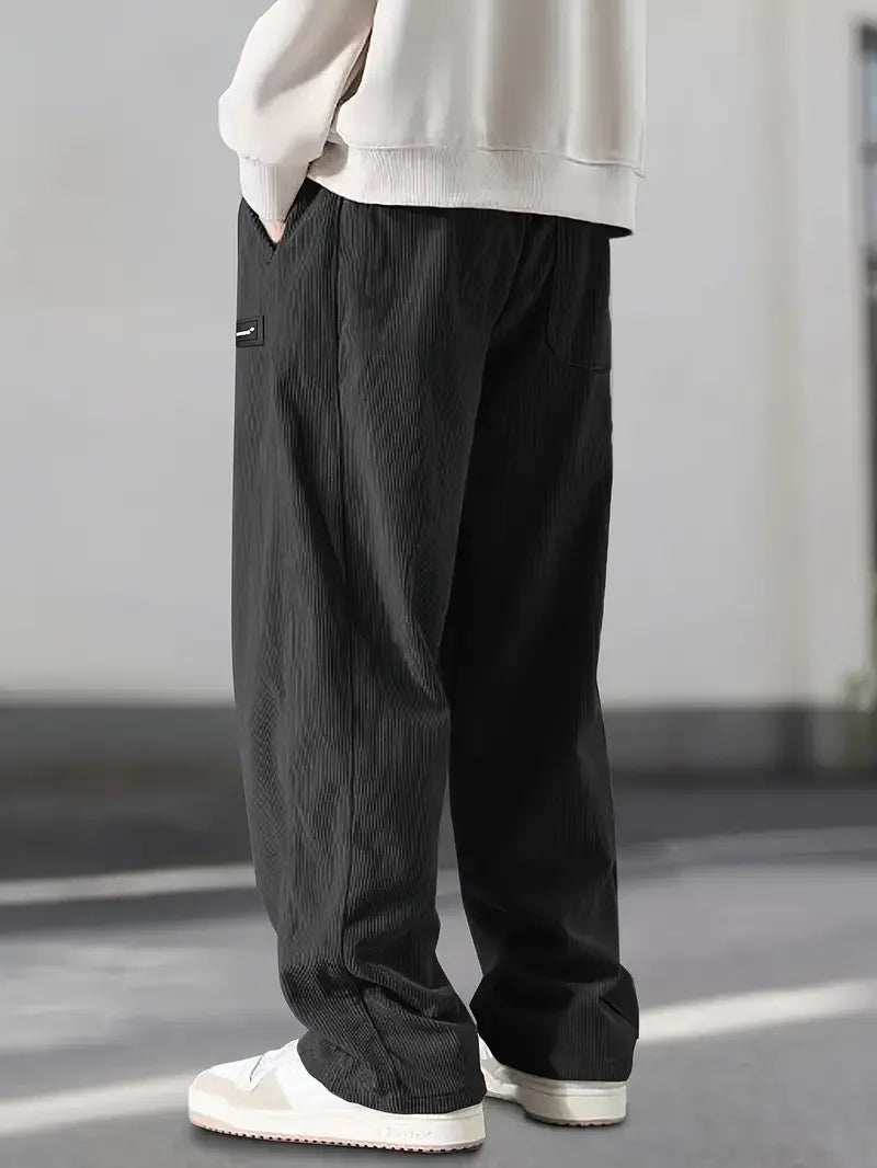 Relaxed fit men's wide leg corduroy pants, comfortable and stylish for streetwear & vintage-inspired outfits.