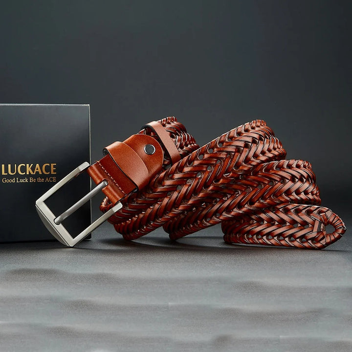 Stylish men's belt: A brown woven leather fashion accessory with a contrasting polished silver buckle.