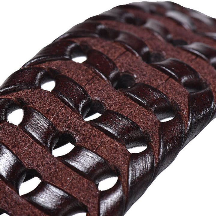 A versatile men's leather belt with a unique woven design and a gleaming, polished metal buckle.