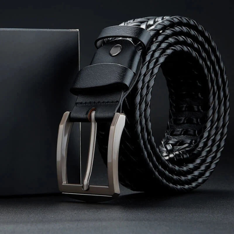 Front shot of a men's durable woven leather belt with a secure and polished metallic buckle.