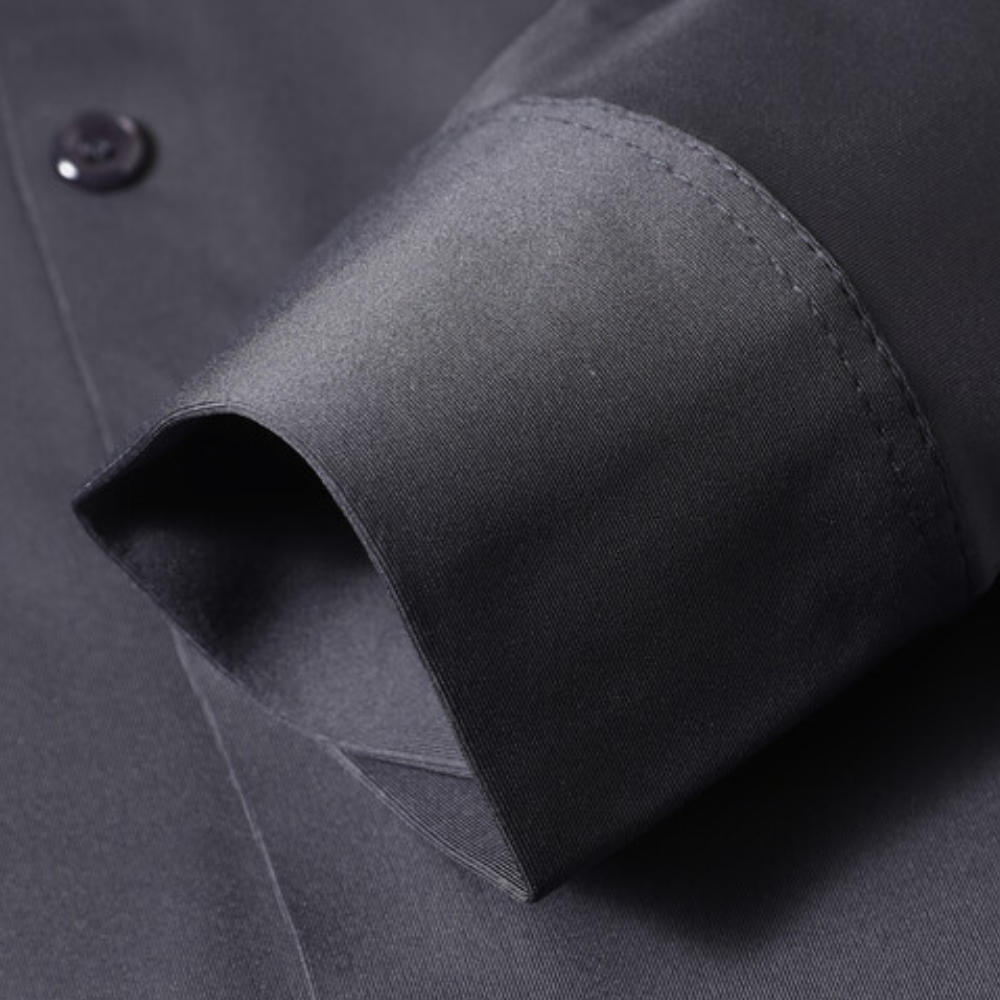 Model wearing a comfortable, timeless men's wrinkle-free dress shirt, ideal for office or evening events.