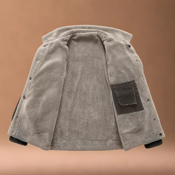 Close-up of durable fabric on Men's Yukon Trucker Jacket, showing classic style and texture.
