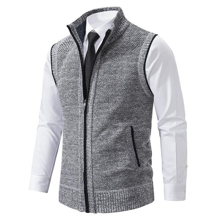 Warm men's knit sweater vest, full zip and mock neck design for comfortable autumn and winter layering.