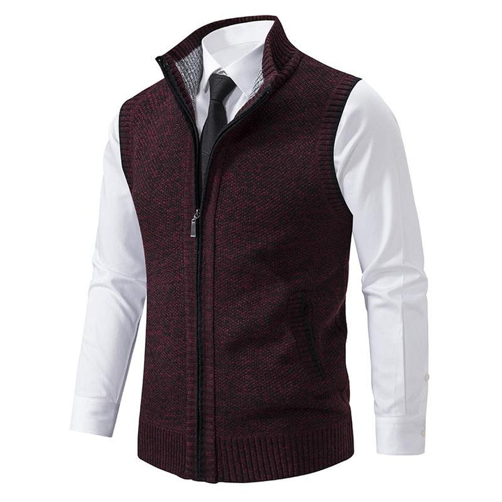 Men's sleeveless knit zip vest, featuring a mock neck and functional design for colder seasons' style.