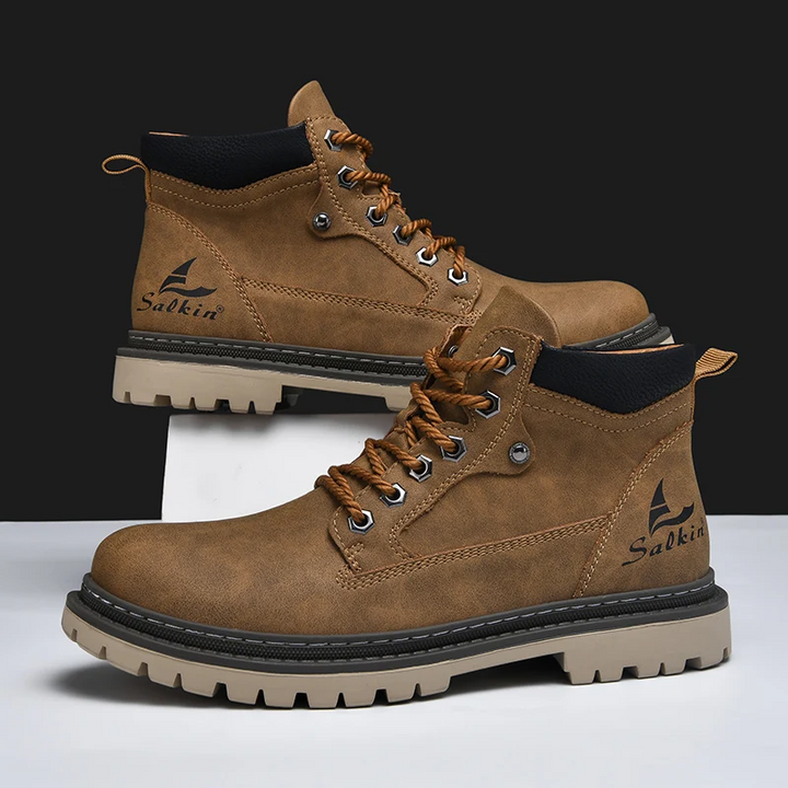 Stylish mens all-terrain boots with durable traction, ideal for hiking and urban exploration. Comfortable fit.