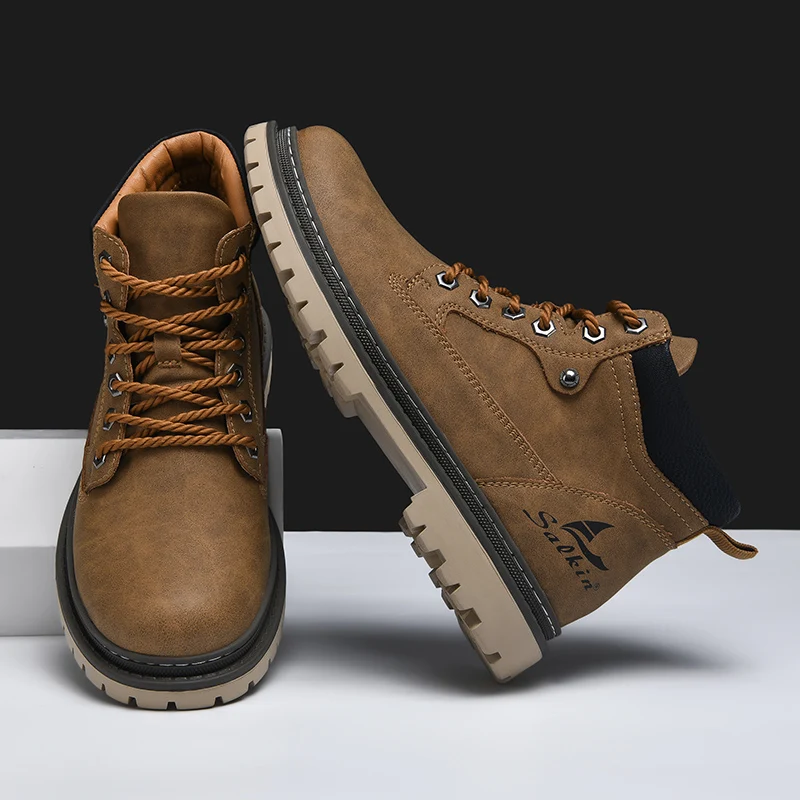 Front view of mens rugged outdoor boots. All-terrain design provides durability & traction for adventure.
