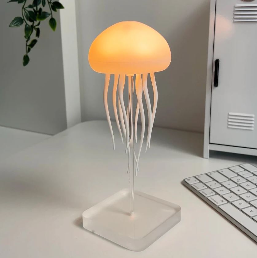 Mesmerizing LED jellyfish aquarium mood lamp, perfect for relaxation and unique home decor. Ambient night light.