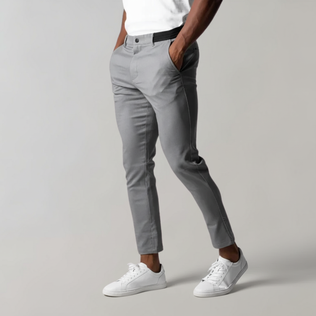 Detail of Mika Men's chino trousers waistline with button and zipper closure, a comfortable fit