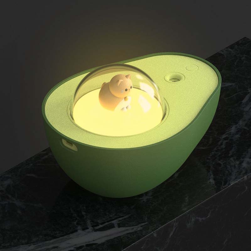 Green avocado-shaped USB humidifier, AvoMist. Compact air purifier, quiet mist for office & home.