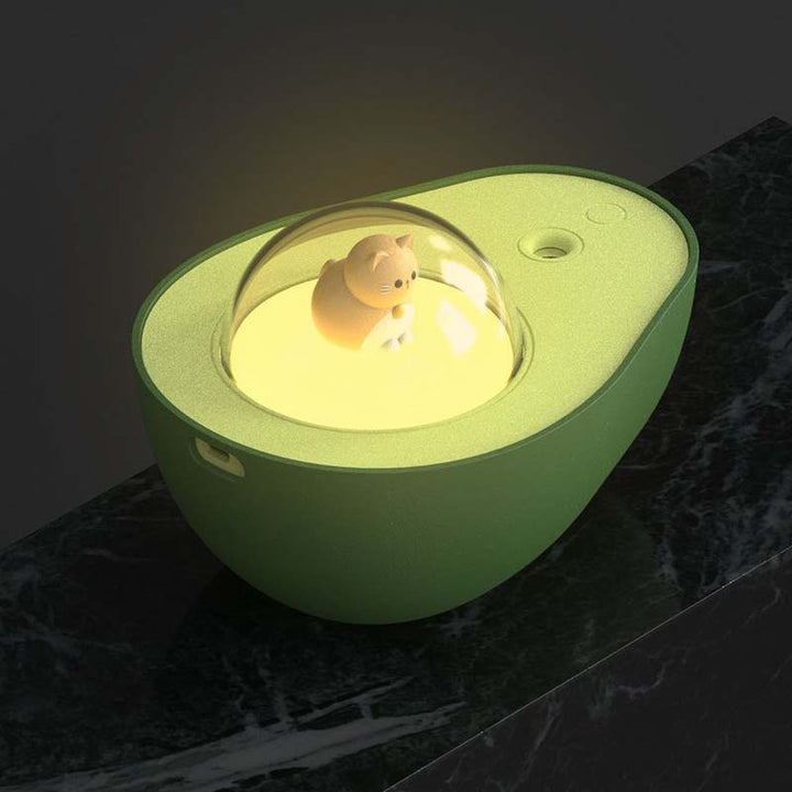 Green avocado-shaped USB humidifier, AvoMist. Compact air purifier, quiet mist for office & home.