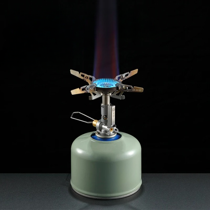 Mini portable camping gas stove with adjustable flame, perfect for outdoor cooking and backpacking.