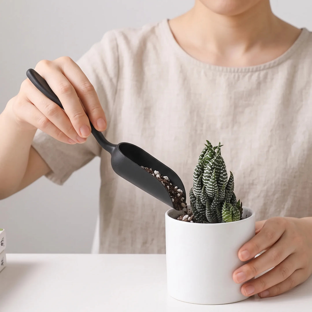 Precision miniature gardening tools for indoor plant care & repotting.