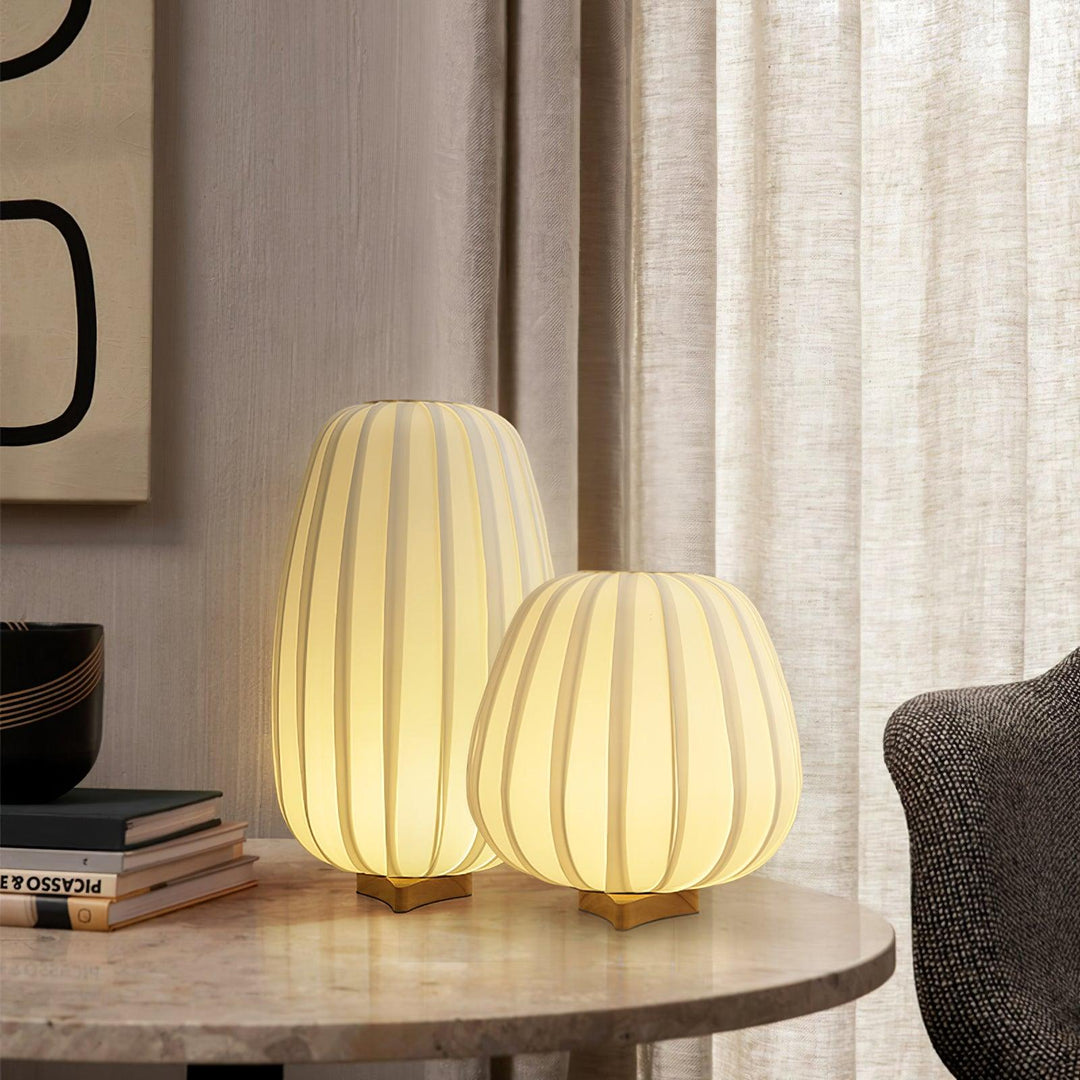 AmbiNook table lamp with a natural bamboo base and white fabric shade, a versatile minimalist design