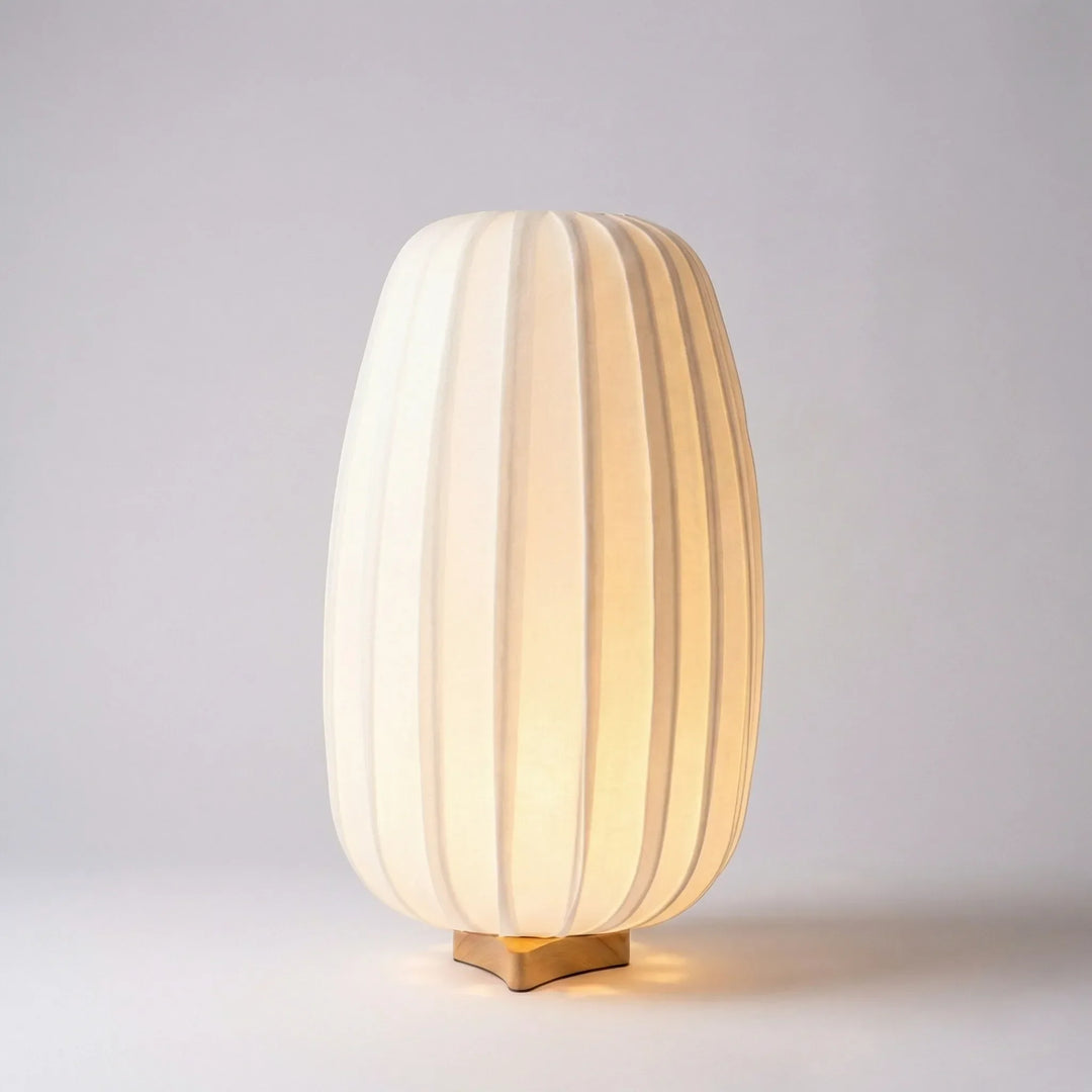 Living room accent: AmbiNook minimalist bamboo table lamp with a fabric shade, offering warm illumination