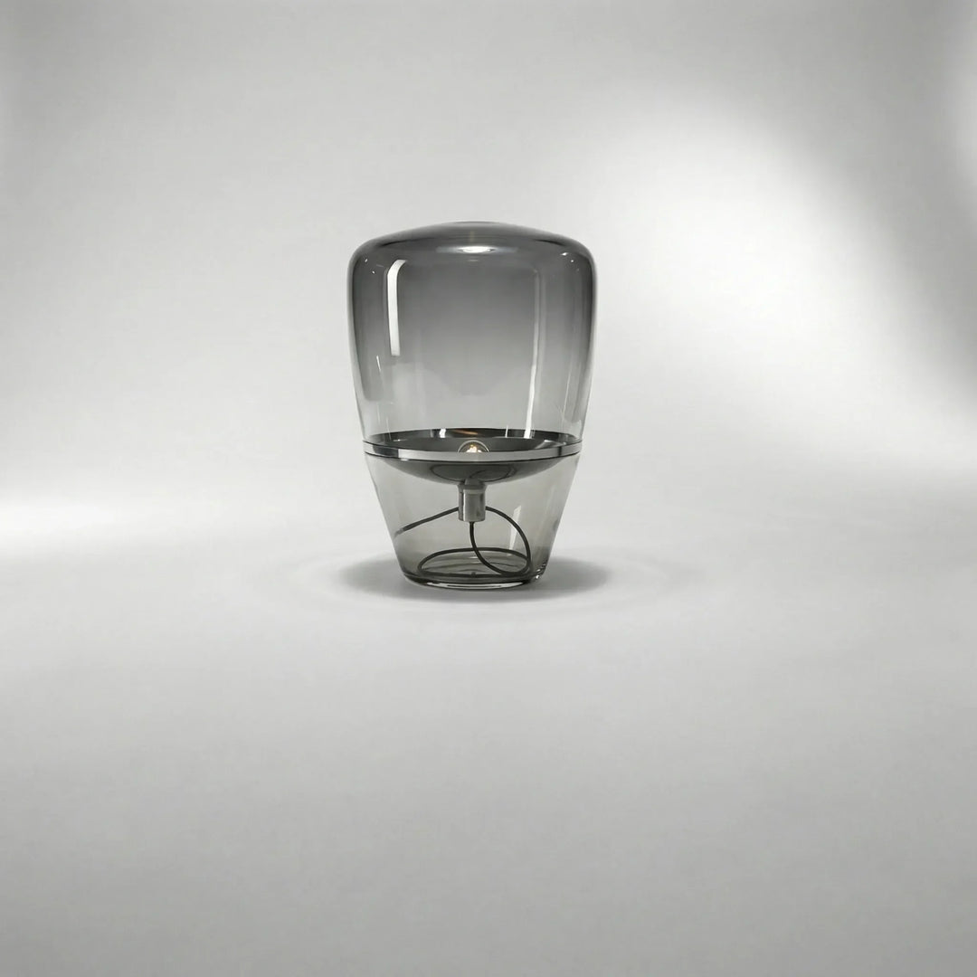 Close-up of Nordella minimalist glass table lamp, showcasing its sleek design and warm LED glow.