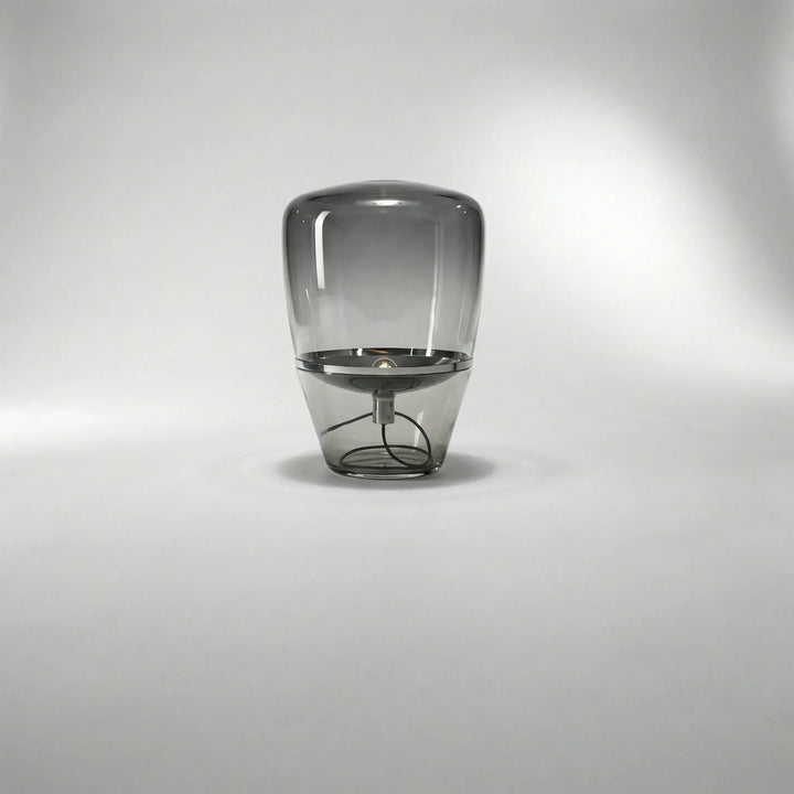 Close-up of Nordella minimalist glass table lamp, showcasing its sleek design and warm LED glow.