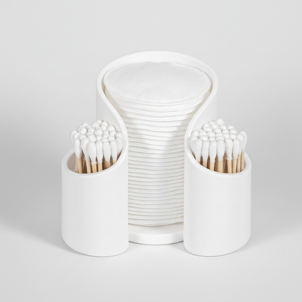 CareCube minimalist bathroom organizer, keeps cotton pads and swabs neatly stored on a vanity.