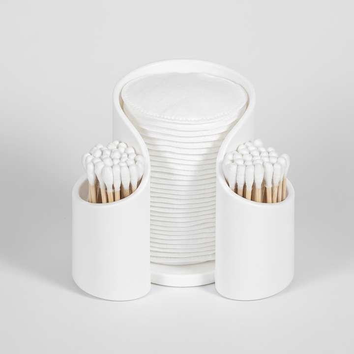 CareCube minimalist bathroom organizer, keeps cotton pads and swabs neatly stored on a vanity.