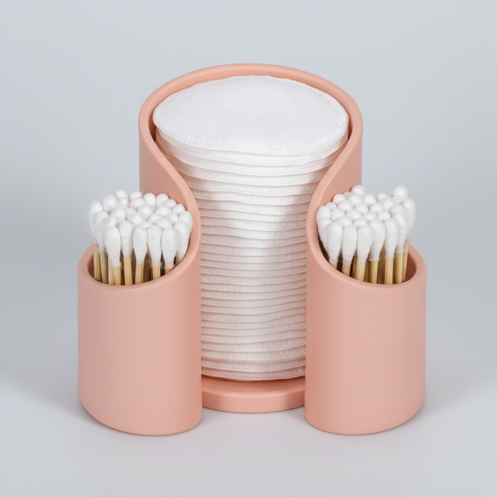 Compact clear plastic organizer, perfect for cotton pads and swabs in a minimalist bathroom.