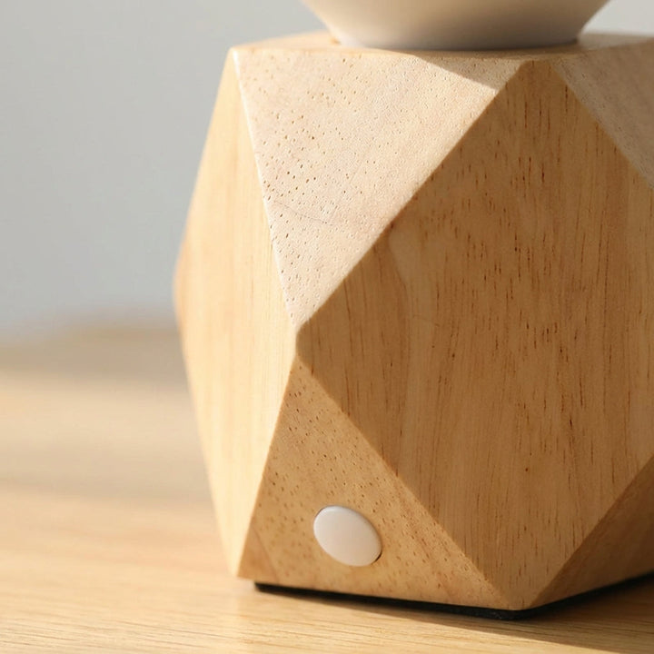 Minimalist Geometric Bedside Table Lamp with unique angular base, perfect for modern bedroom decor.