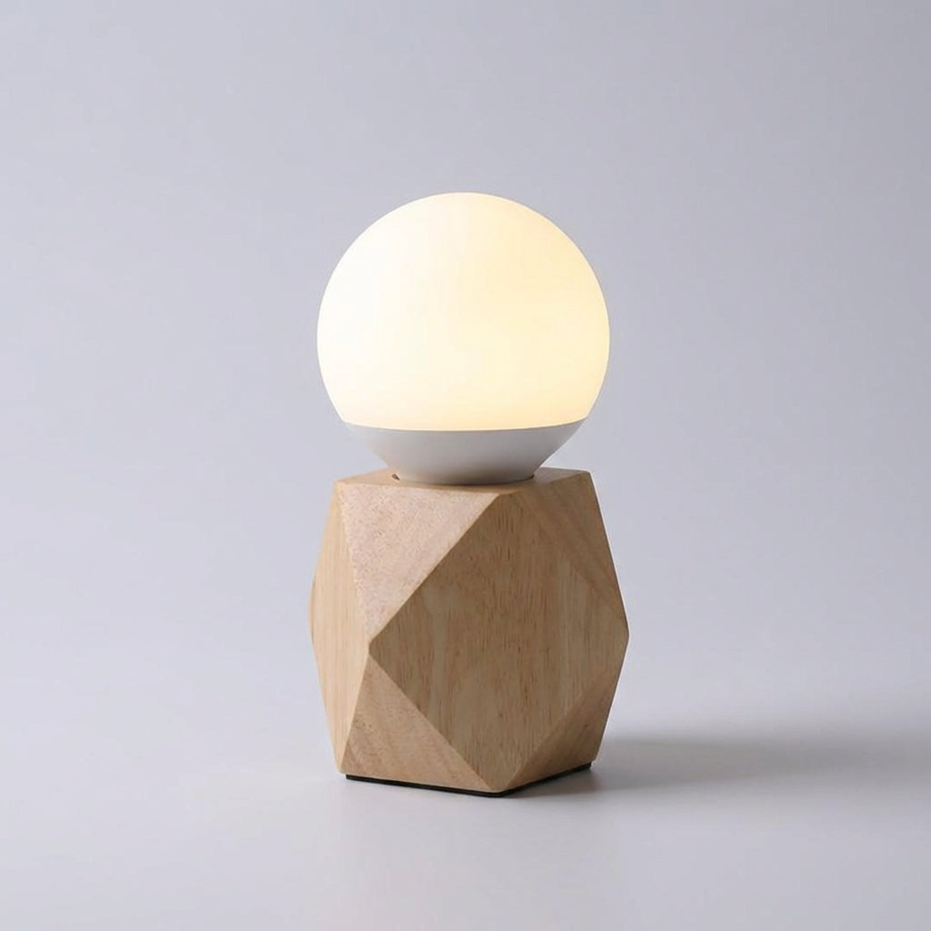 Modern geometric table lamp featuring a sleek design and convenient USB charging port for bedside use.