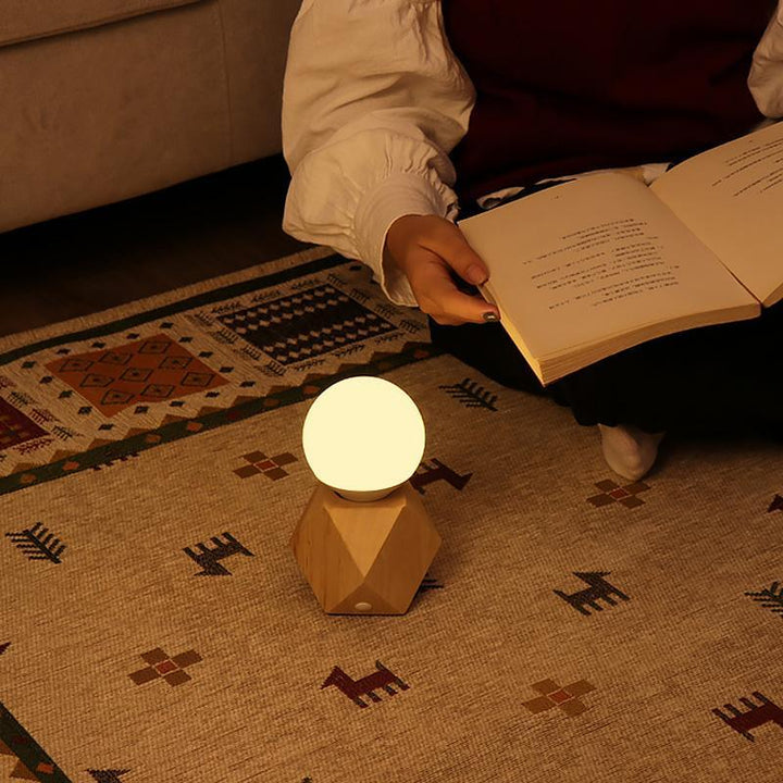 Stylish LED table lamp in a geometric design, offering soft illumination and a Nordic aesthetic.
