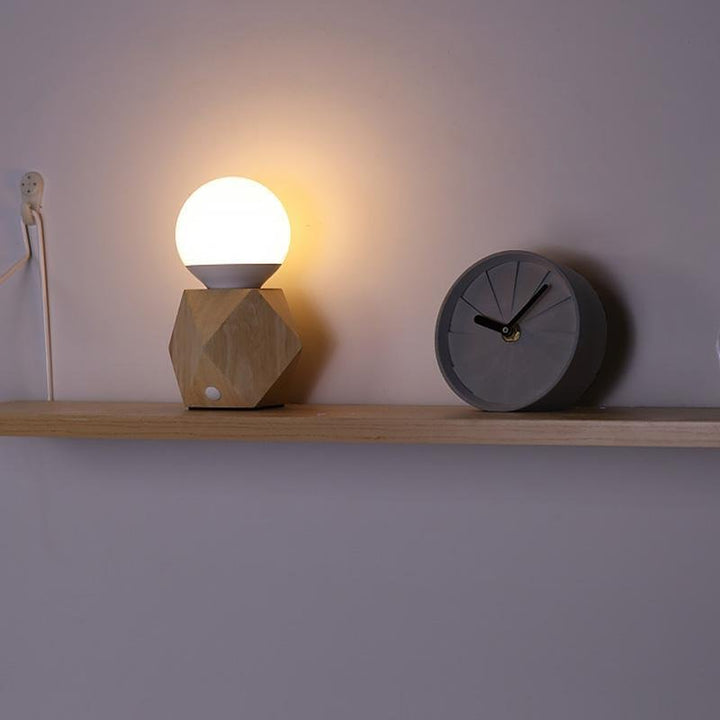 Nordic-inspired geometric bedside lamp, a modern decor piece with integrated LED and USB charging.