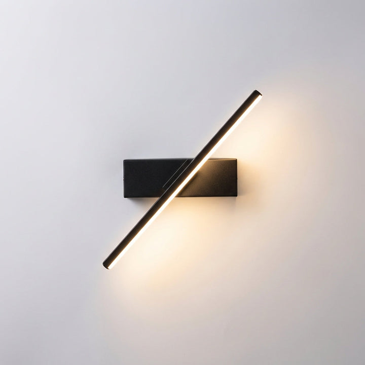 Indoor minimalist linear wall light from Swaylux, casting warm LED light on a textured wall