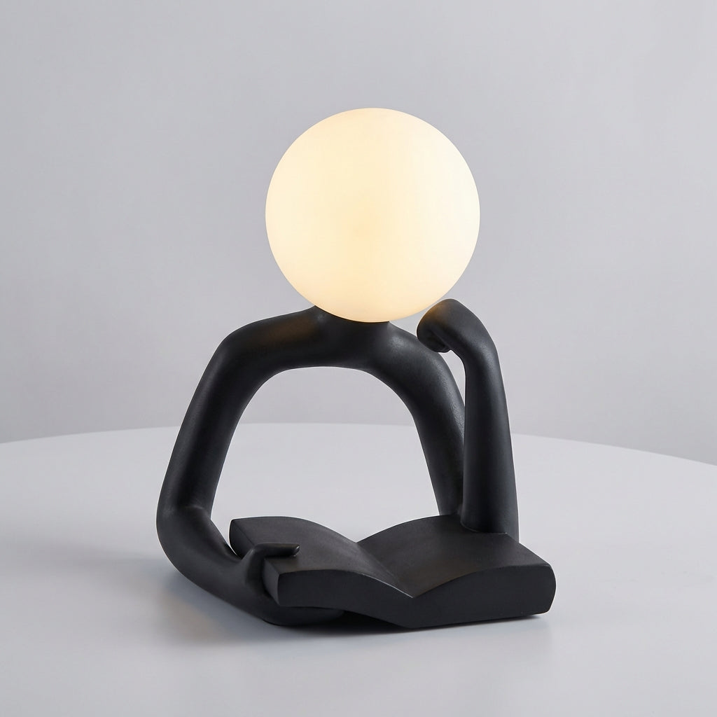 Abstract sculptural LED lamp, minimalist design, USB powered for convenient desk lighting.