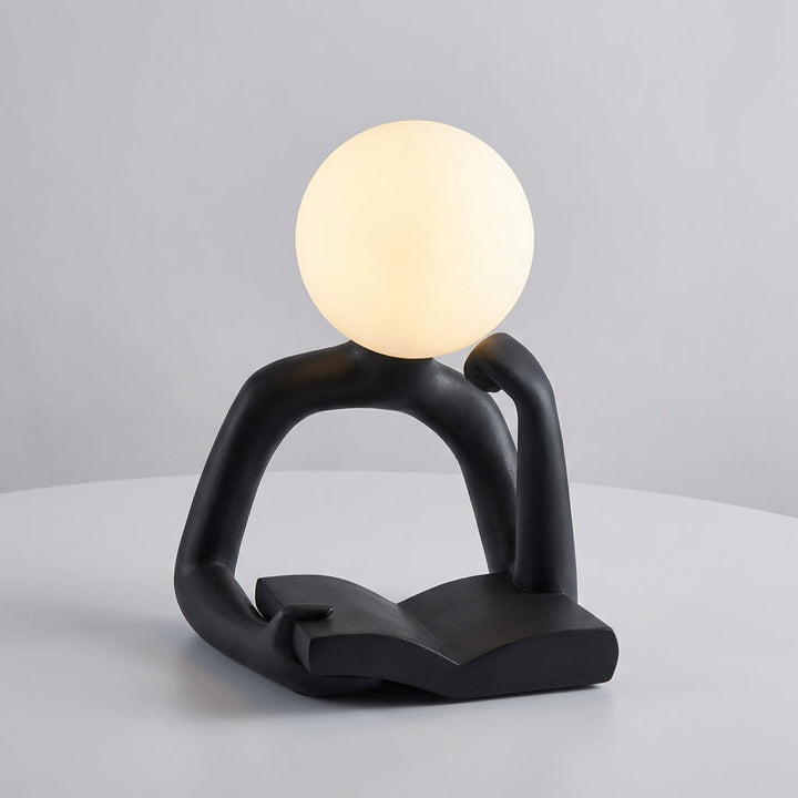 Abstract sculptural LED lamp, minimalist design, USB powered for convenient desk lighting.