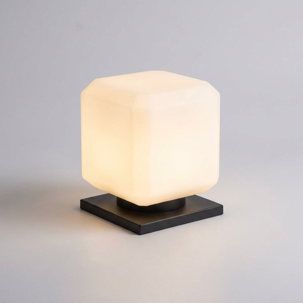 Compact Lumiqube Solar Cube Outdoor Lamp charging in sunlight, weatherproof garden light.