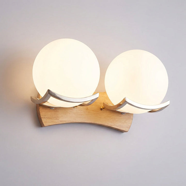 Spherical minimalist wall light by Zenivio, chic LED sconce combines wood & metal for modern spaces.