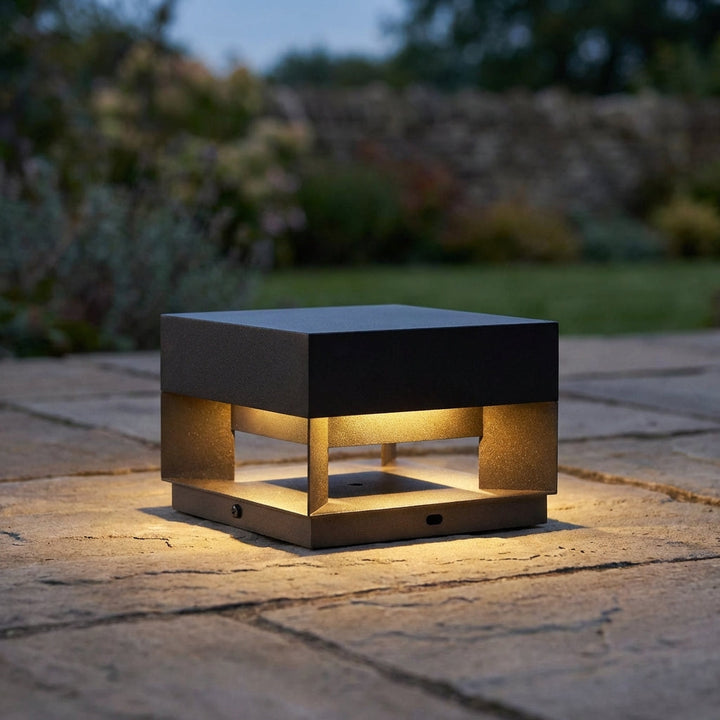 Minimalist square LED outdoor wall light, modern design for patio or garden lighting.