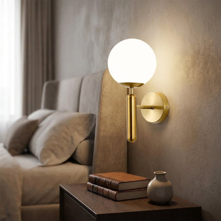 Minimalist Veloriq LED wall sconce, gold finish, milk glass, ambient light, modern decor.