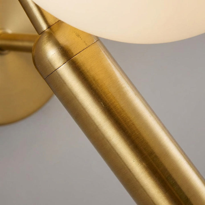 Elegant Veloriq wall sconce, gold, LED light, milk glass shade, perfect for ambient lighting.