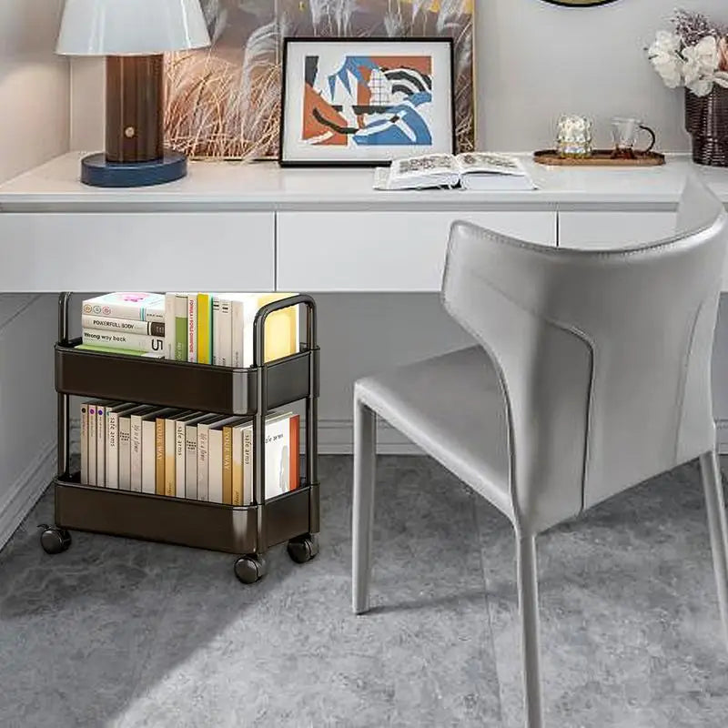 Multi-functional mobile bookshelf with 2 tiers, wheels, and pen holder for convenient home storage.