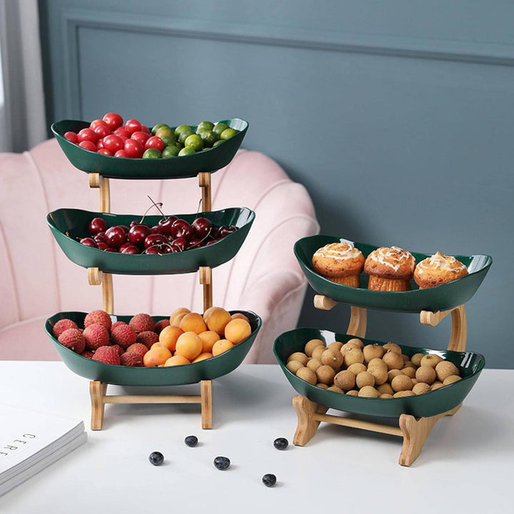 Sleek modern metal fruit stand, 3-tier design for efficient kitchen countertop storage of fruits & vegetables.