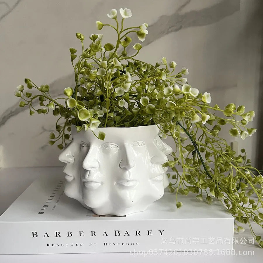 Sleek 'FaceBloom' 3D face planter. Minimalist modern artistic decor for contemporary home spaces.