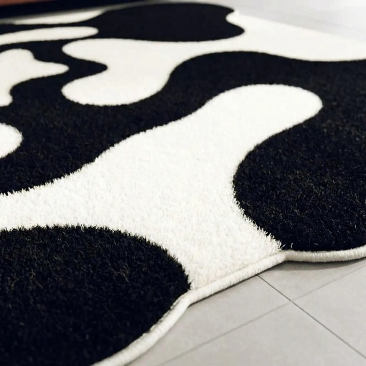 Abstract Flowique wave area rug, a modern statement piece. Perfect floor decor for contemporary living or bedroom.