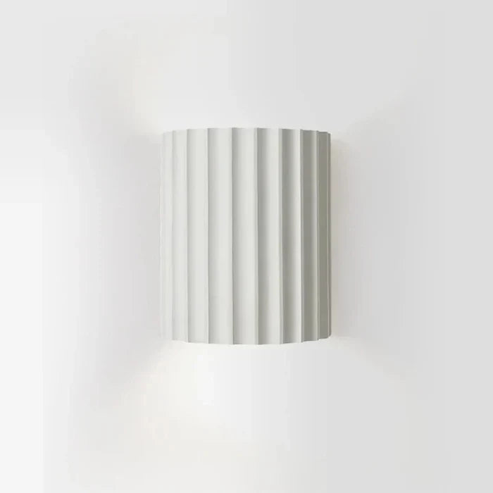 Modern abstract resin wall sconce lamp with LED lighting, elegant home decor.