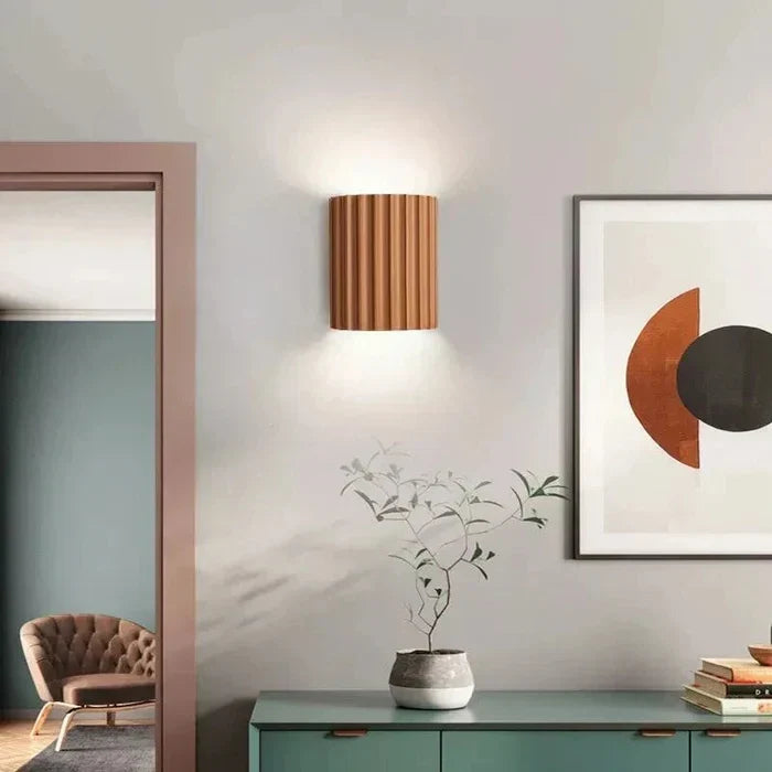 Decorative LED wall sconce, unique abstract design for modern homes.