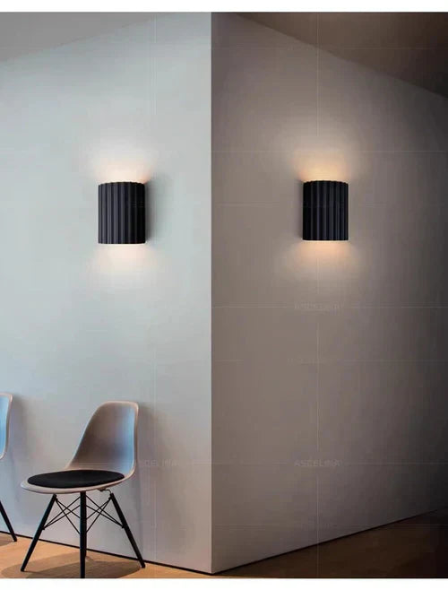 Handcrafted resin light fixture, modern wall decor accent.