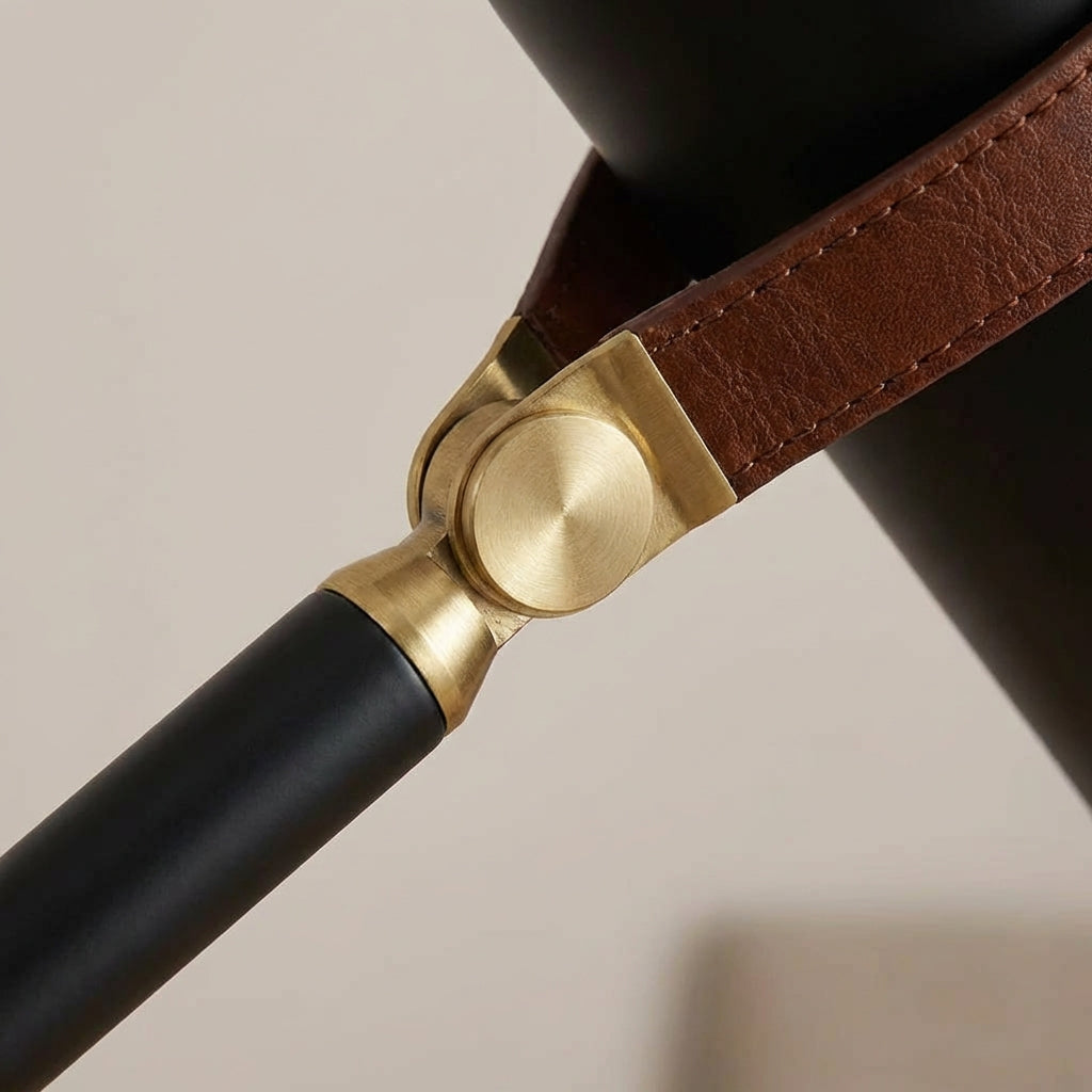 Close-up of the articulated arm of a Deskora adjustable desk lamp, highlighting its modern design for reading.