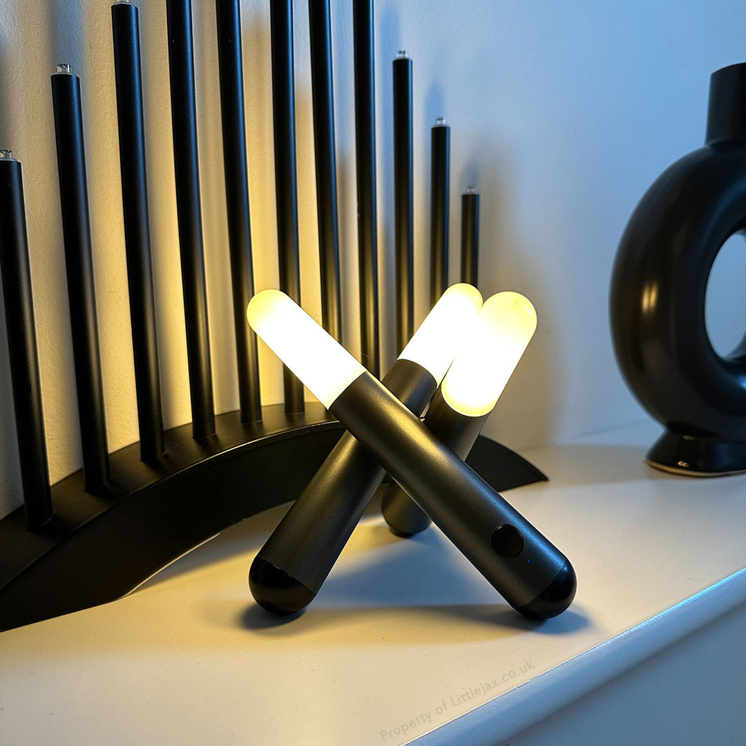 Contemporary bronze Trivela three-head adjustable table lamp, perfect for office or ambient home lighting