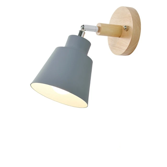 Contemporary adjustable wall light with a toggle pull switch, providing targeted lighting for reading or tasks.