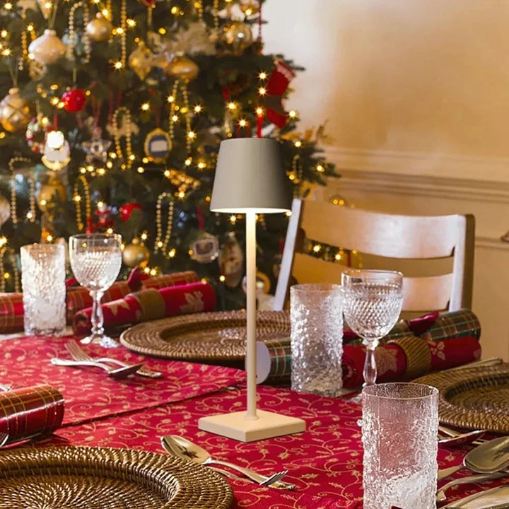 Modern aluminum dimmable portable table lamp, wireless & rechargeable LED for versatile use.