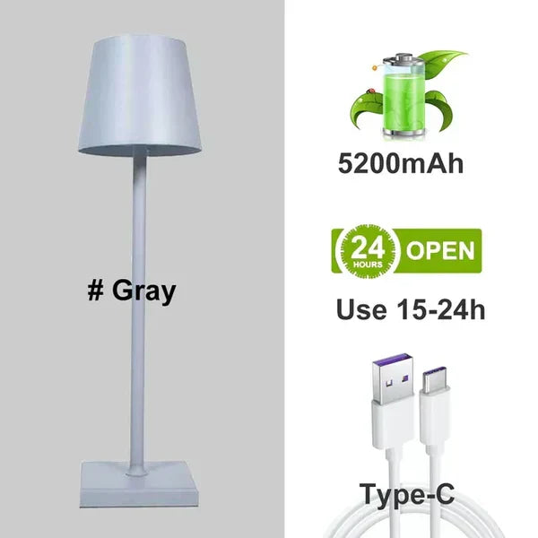 Minimalist modern portable LED table lamp. Dimmable, wireless & rechargeable for stylish home accent lighting.