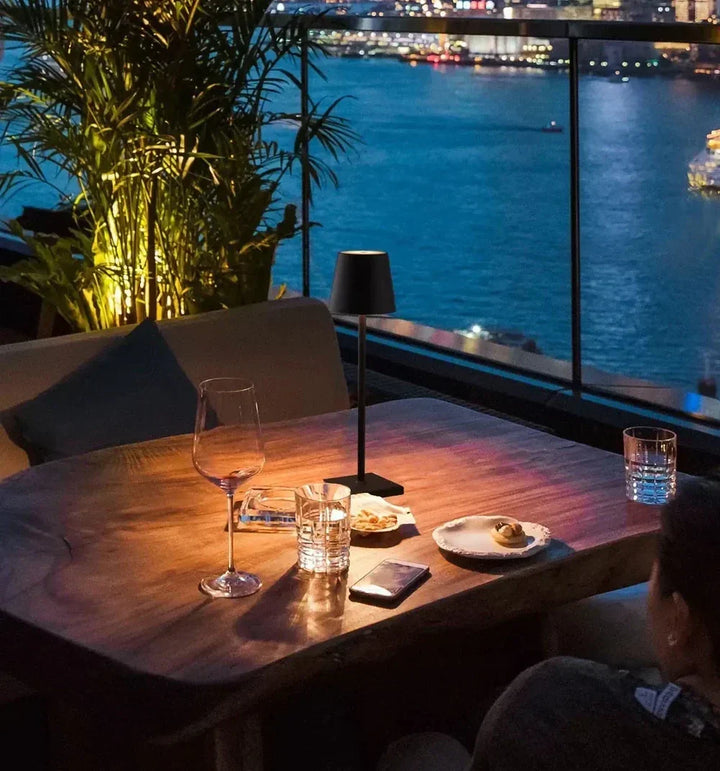 Stylish wireless dimmable LED table lamp. Rechargeable & portable, perfect for reading or mood lighting.