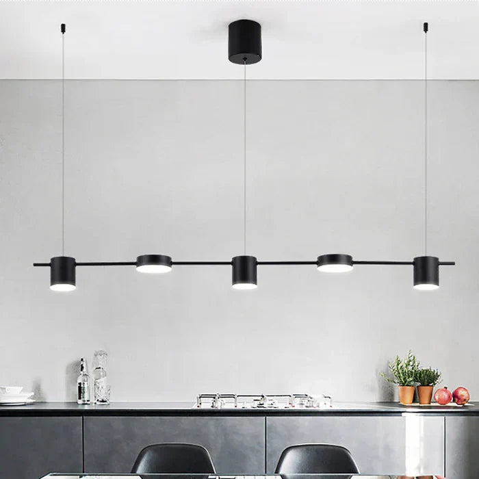 Sleek gold drum ceiling pendant light, perfect for modern dining room ambiance.