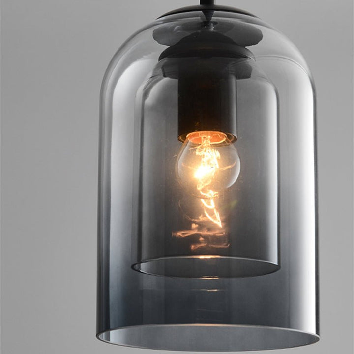 Sleek modern double glass pendant light, elegant ceiling fixture enhancing contemporary home interiors.